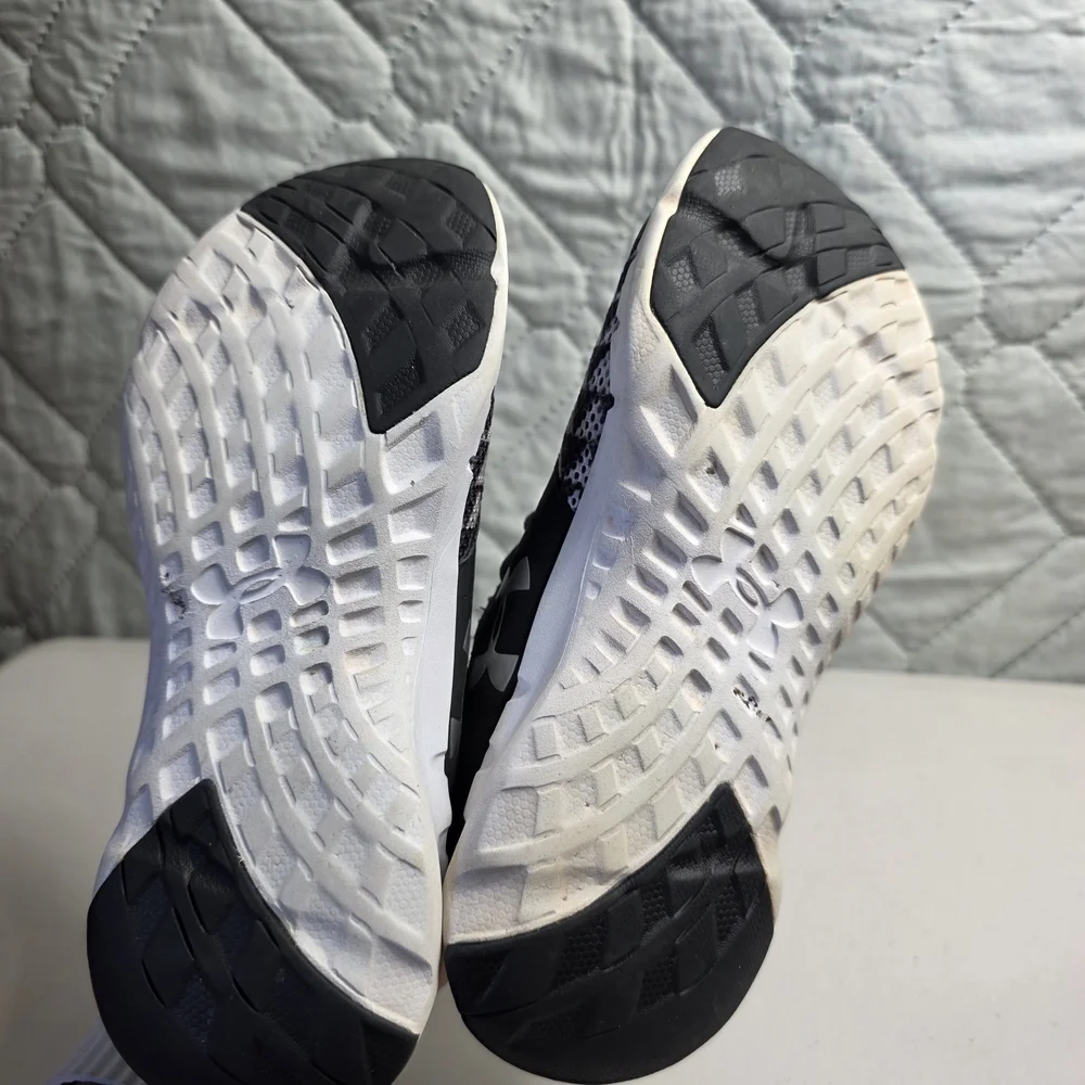 Under Armour kids' athletic sneakers in black and white. Size 3.5Y